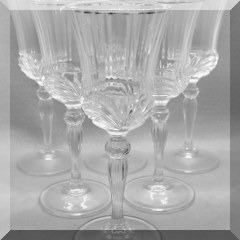 G24. Set of 8 pressed wine goblets w/gold on rim 6-8”h and 2-7.5”h - $10